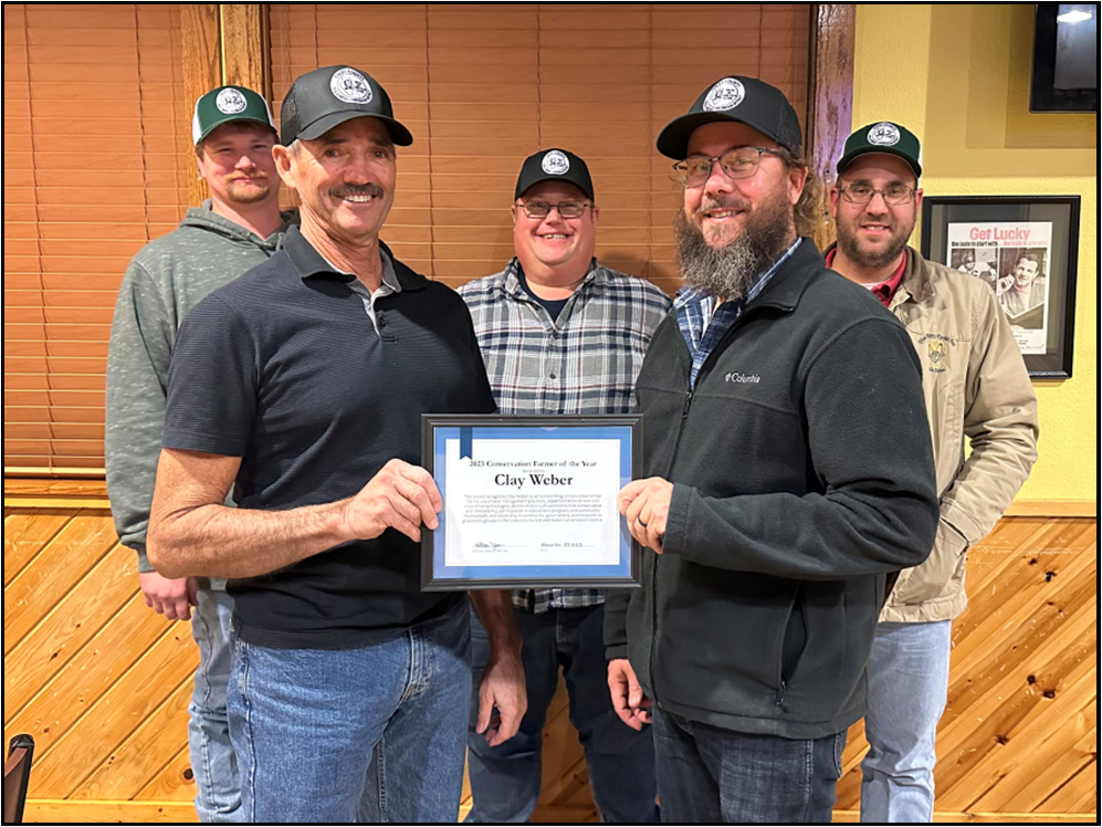 The Coles County SWCD presented Clay Weber of rural Ashmore with the 2023 Conservation Farmer of the Year Award at the SWCD’s annual holiday party and award ceremony. Pictured (left to right) are Justin Thomas (vice chairman), Bill Janes (chairman), Todd Easton (secretary/treasurer), Clay Weber, and J.C. Doty (board member). 